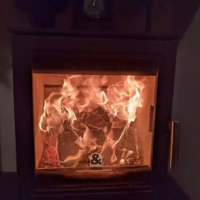 Birch log on fire in a wood burning stove