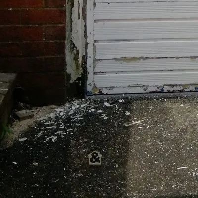 Pant scrapings after preparing garage door for painting