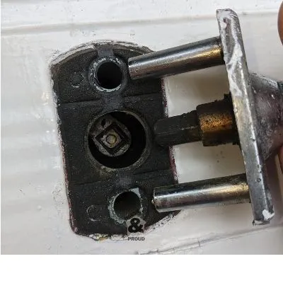 Removing a garage door lock before painting a garage door