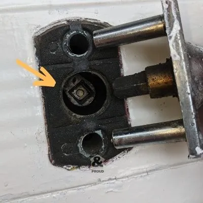Slot to recieve spindle on a garage door lock