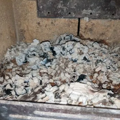 Build up of excess ash in base of wood burning stove which can make it harder to maintain