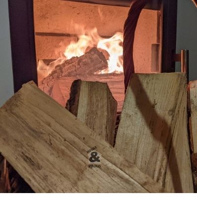 basket full of oak and birch logs for wood burning stove with low moisture content