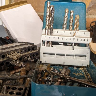 messy drill bits on garage shelf